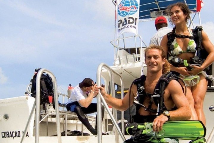 a group of people riding on the back of a boat