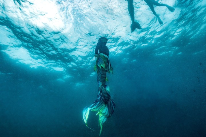 a man that is standing in the water